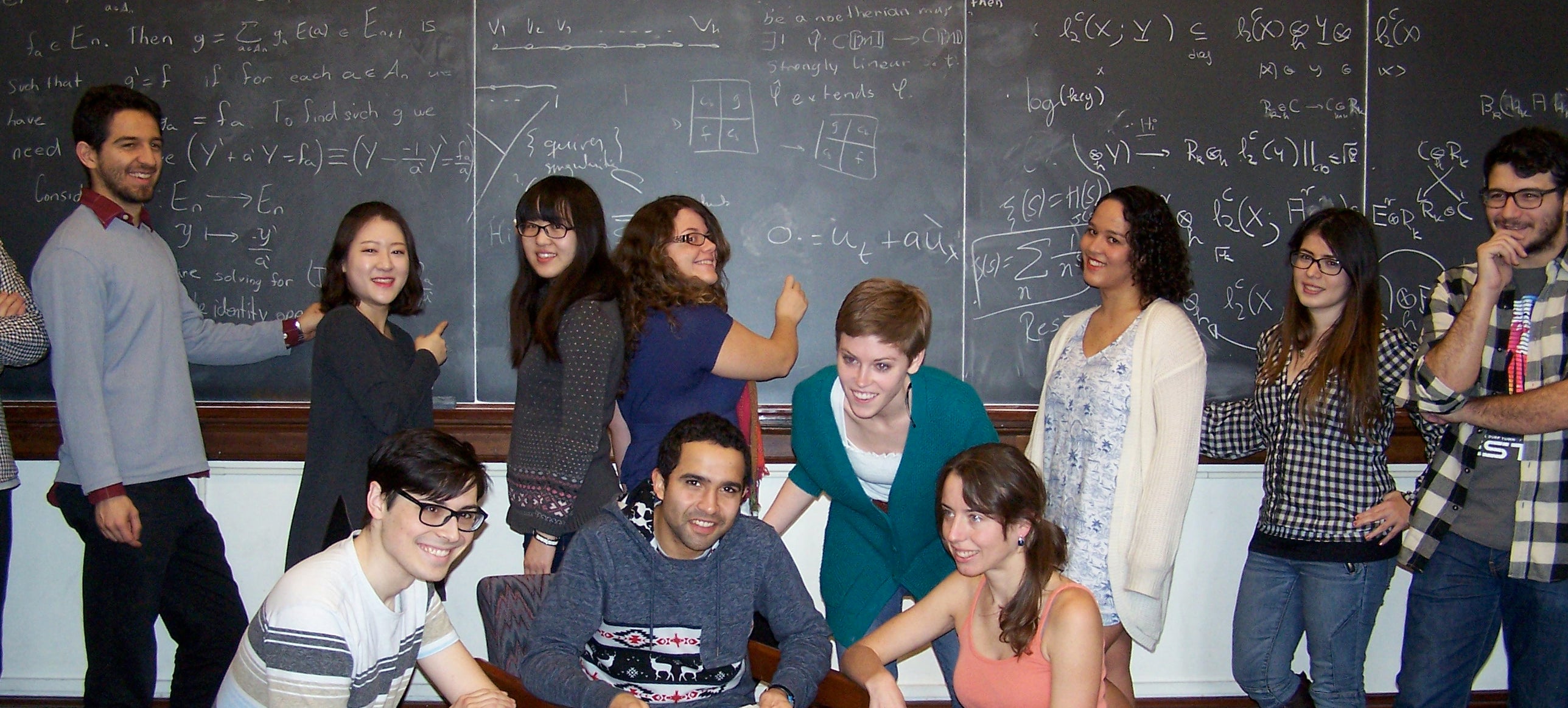  math students in front of white board 