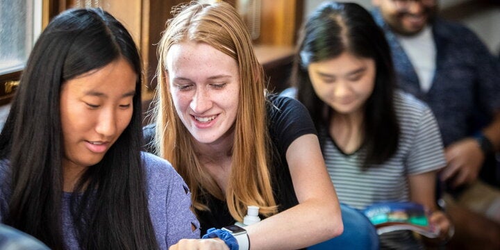 Student assisting another student