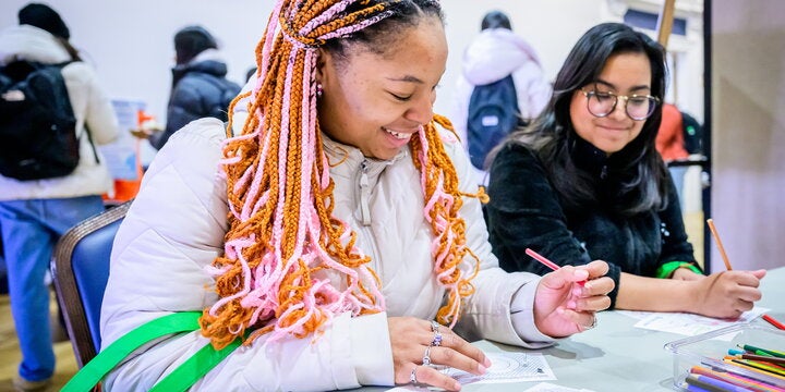 Students working at table.