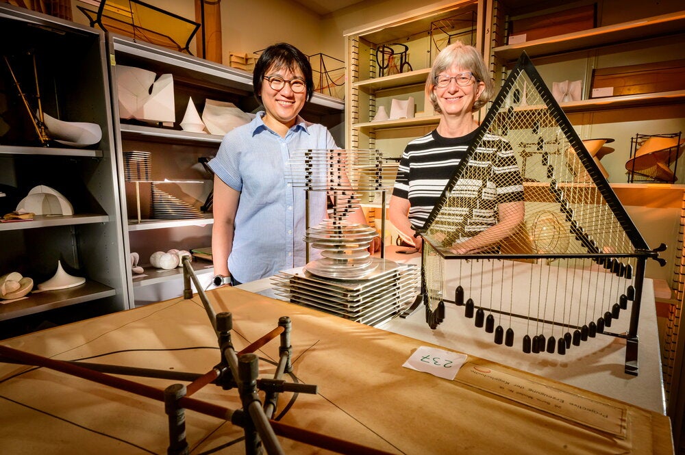 Sarah Park and Karen Mortensen in front of the Mathematical Models collection.