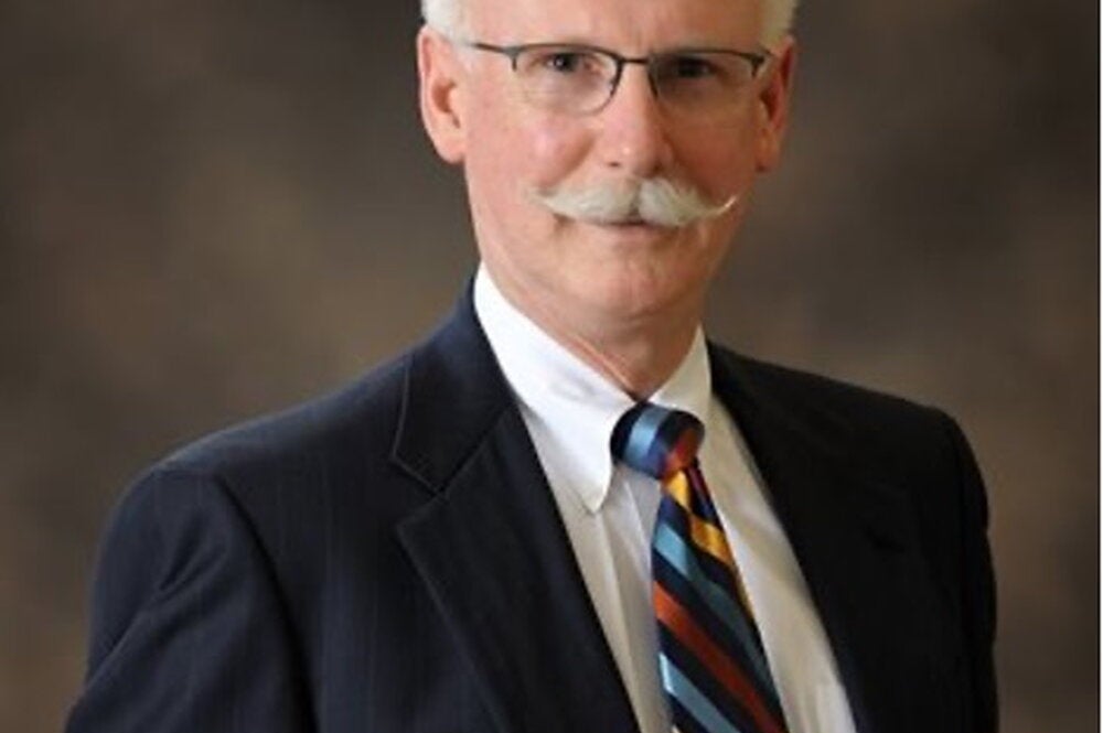 Scott H. Fisher wearing a suit.