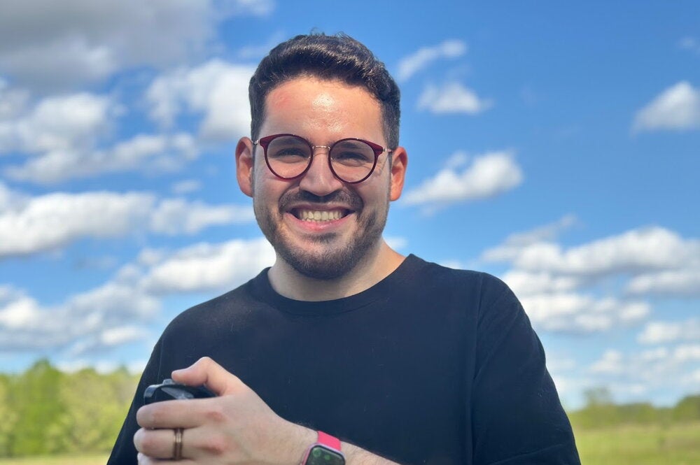 Vincent Villalobos in front of grass field and cloudy sky
