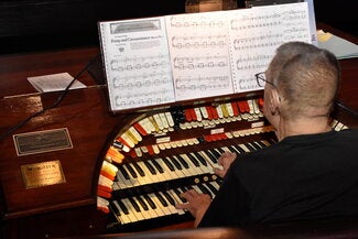David Schroeder playing the Wurlitzer Pipe Organ at the Virginia Theatre, Math Convocation 2025