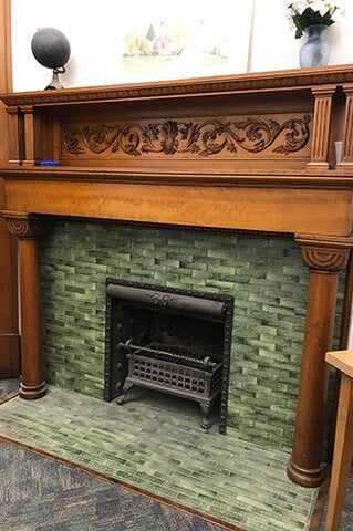 An ornate fireplace in the undergraduate office of the Department of Mathematics.