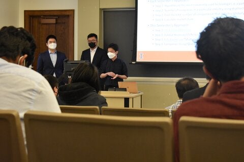 three students present findings of their research for IRisk Lab