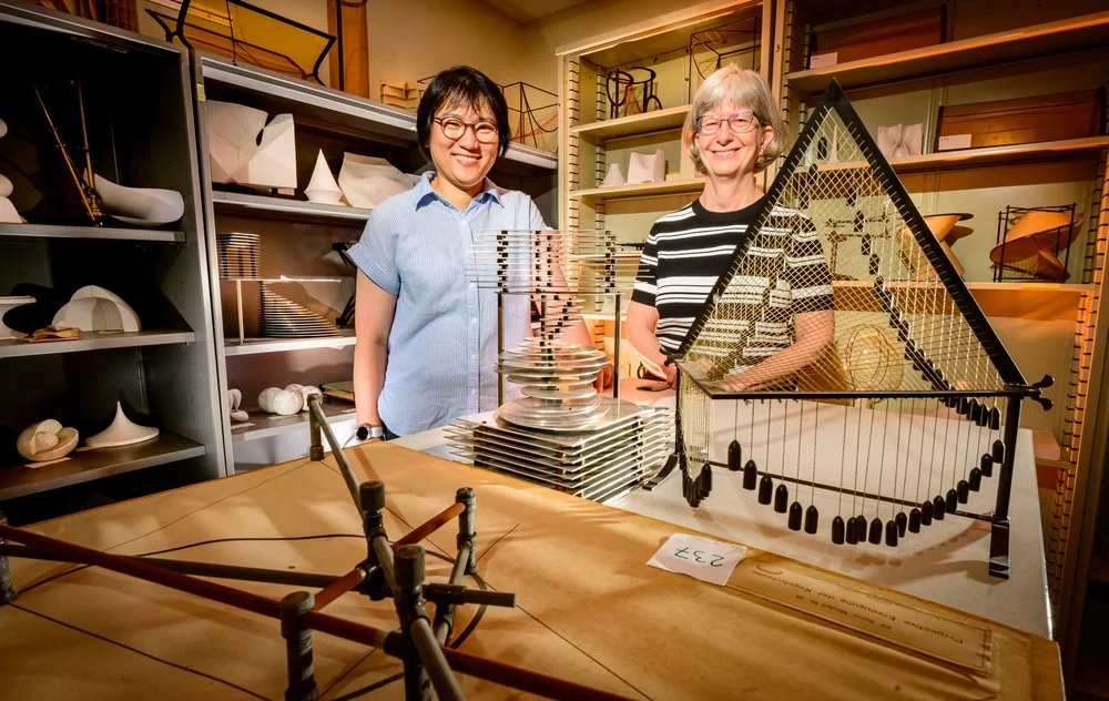 Sarah Park and Karen Mortensen in front of the Mathematical Models collection.