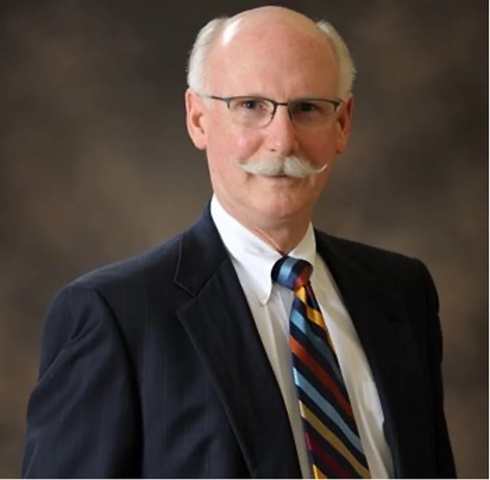 Scott H. Fisher wearing a suit.