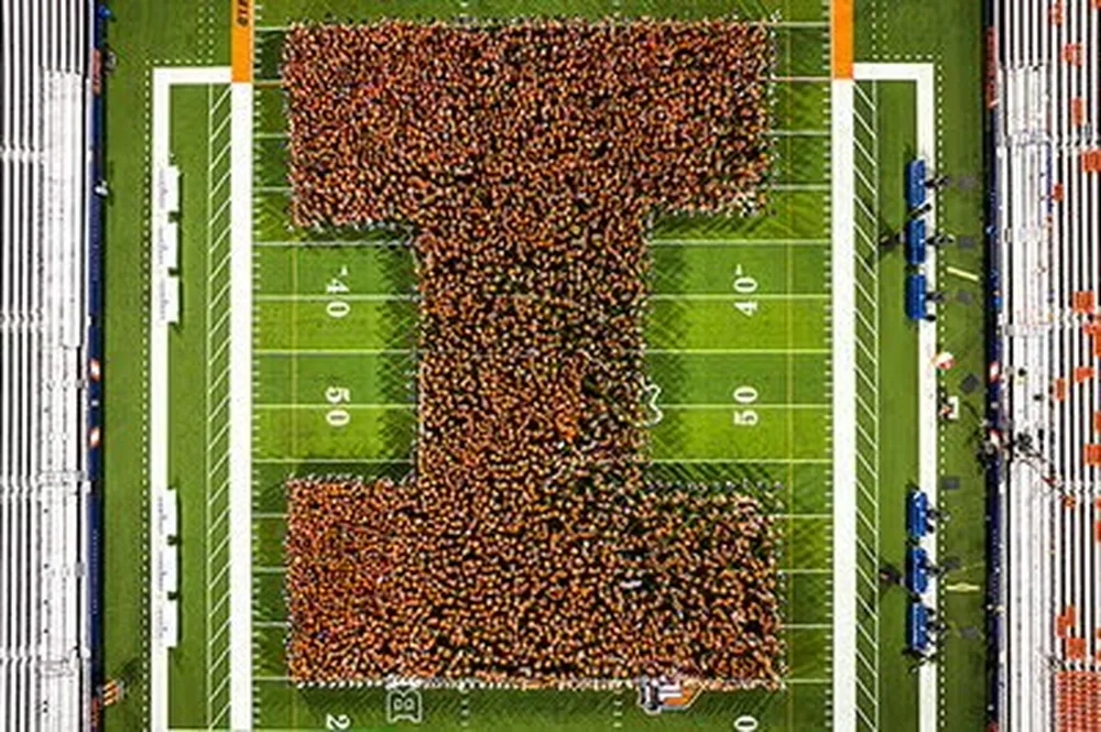 Students in the shape of the Block I on football field.
