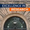 main entryway of Altgeld Hall, the home of the mathematics department; a banner in the foreground reads "Excellence in Research"