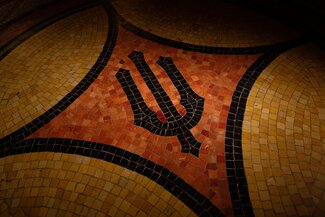 U of I mosaic on floor to entrance of mathematics library in Altgeld Hall