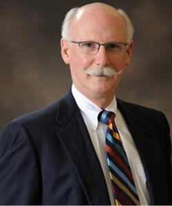 Scott H. Fisher wearing a suit.