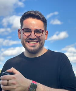 Vincent Villalobos in front of grass field and cloudy sky